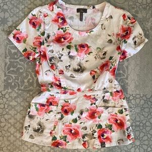 Jaanuu floral peplum scrub top.